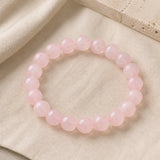 Bracelet en quartz rose naturel avec perles rondes de 10 mm.